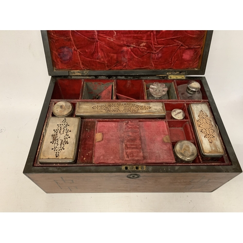 37 - A VINTAGE MAHOGANY VANITY CASE CONTAINING A FITTED SECTION OF JARS AND BOTTLES, SOME WITH SILVER HAL... 