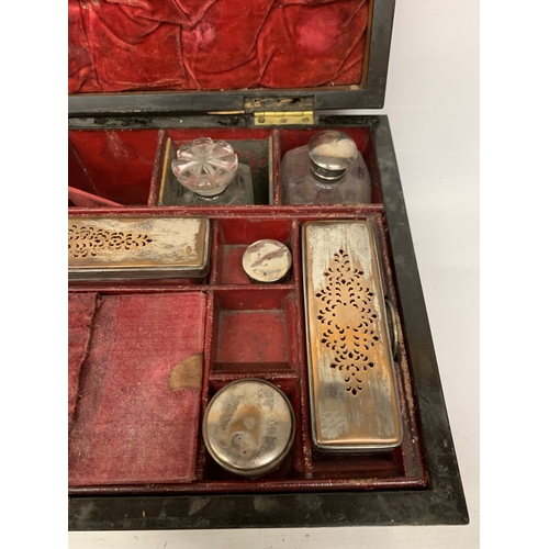 37 - A VINTAGE MAHOGANY VANITY CASE CONTAINING A FITTED SECTION OF JARS AND BOTTLES, SOME WITH SILVER HAL... 