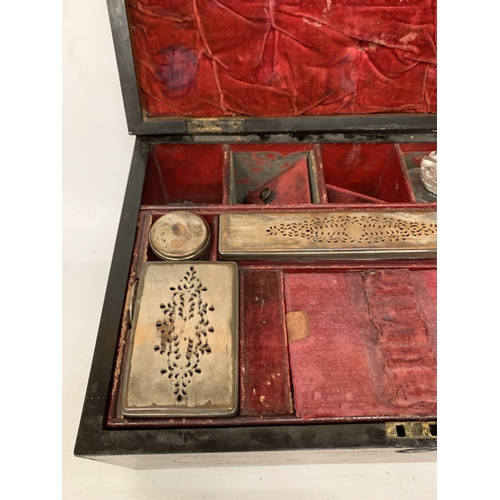 37 - A VINTAGE MAHOGANY VANITY CASE CONTAINING A FITTED SECTION OF JARS AND BOTTLES, SOME WITH SILVER HAL... 