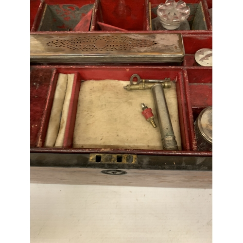 37 - A VINTAGE MAHOGANY VANITY CASE CONTAINING A FITTED SECTION OF JARS AND BOTTLES, SOME WITH SILVER HAL... 