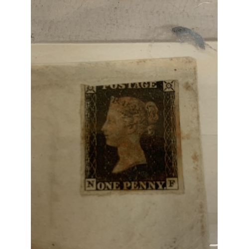 12 - AN 1840 PENNY BLACK STAMP ON AN ENVELOPE SHOWING STRIKES OF MORETON HAMPSTEAD AND EXETER