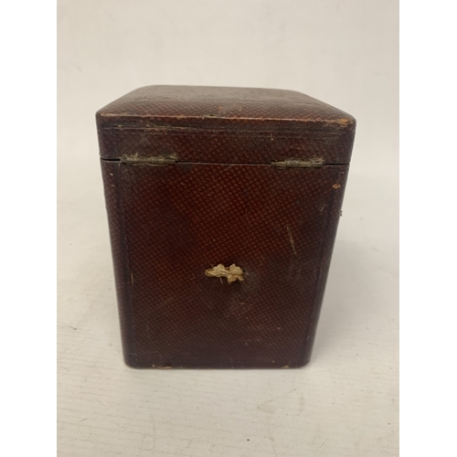 34 - AN ANTIQUE CYLINDRICAL BRASS CARRIAGE CLOCK WITH VISIBLE ESCAPEMENT IN A LEATHER TRAVELLING CASE