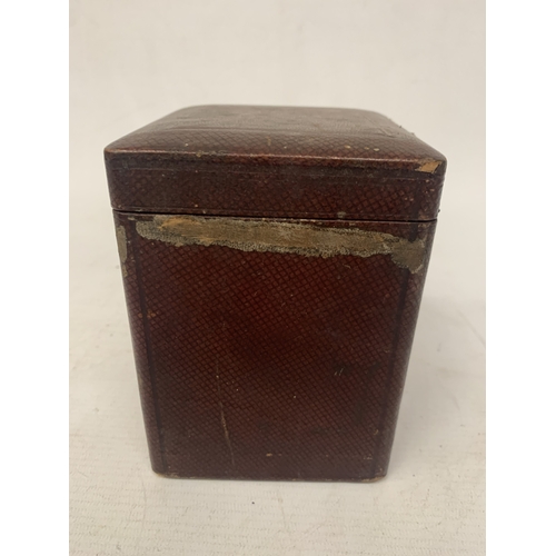 34 - AN ANTIQUE CYLINDRICAL BRASS CARRIAGE CLOCK WITH VISIBLE ESCAPEMENT IN A LEATHER TRAVELLING CASE