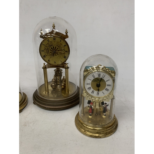 57 - FIVE ANNIVERSARY CLOCKS UNDER GLASS AND PLASTIC DOMES