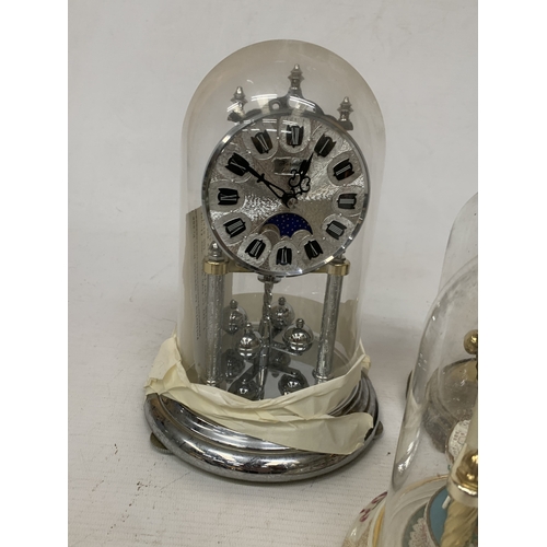 57 - FIVE ANNIVERSARY CLOCKS UNDER GLASS AND PLASTIC DOMES