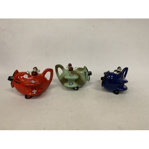 40 - THREE VINTAGE CARLTON WARE AEROPLANE TEAPOTS TO INCLUDE THE LUCY MAY, RED BARON AND BLUE MAX