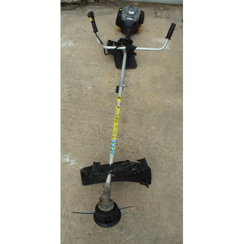 58 - A TITAN PETROL STRIMMER  + VAT