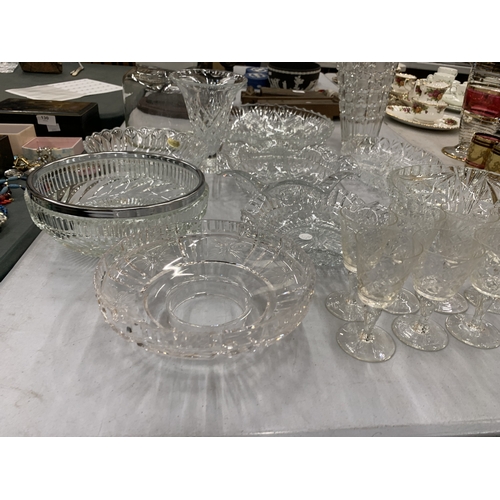 129 - A LARGE ASSORTMENT OF CUT GLASS PIECES TO INCLUDE PLATES, BOWLS, VASES, JARS ETC