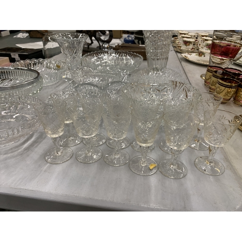 129 - A LARGE ASSORTMENT OF CUT GLASS PIECES TO INCLUDE PLATES, BOWLS, VASES, JARS ETC