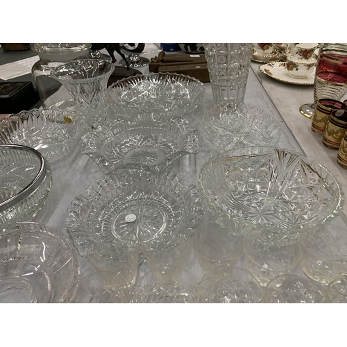 129 - A LARGE ASSORTMENT OF CUT GLASS PIECES TO INCLUDE PLATES, BOWLS, VASES, JARS ETC
