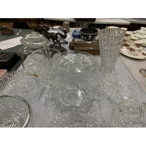 129 - A LARGE ASSORTMENT OF CUT GLASS PIECES TO INCLUDE PLATES, BOWLS, VASES, JARS ETC