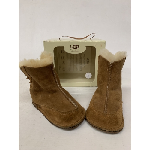 188 - A BOXED PAIR OF CHILDRENS MOCCASSIN BOOTS MARKED 'UGG'