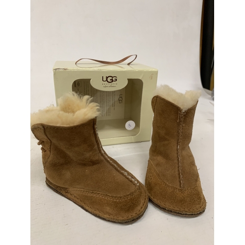 188 - A BOXED PAIR OF CHILDRENS MOCCASSIN BOOTS MARKED 'UGG'