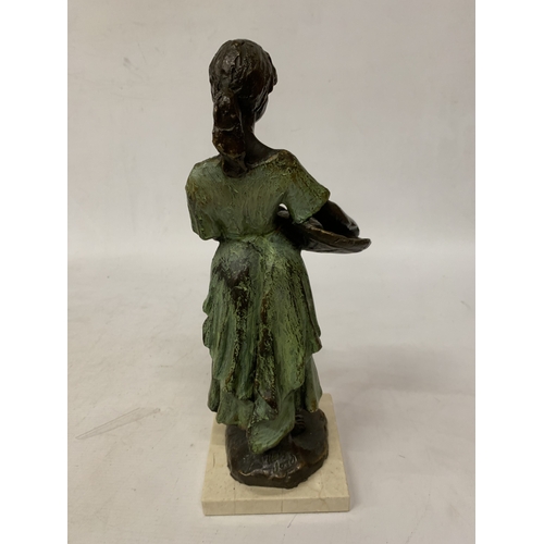 29 - A BRONZE SCULPTURE OF A YOUNG DUTCH GIRL HOLDING A BASKET IN THE STYLE OF WORKS BY SWEDISH ARTIST RU... 