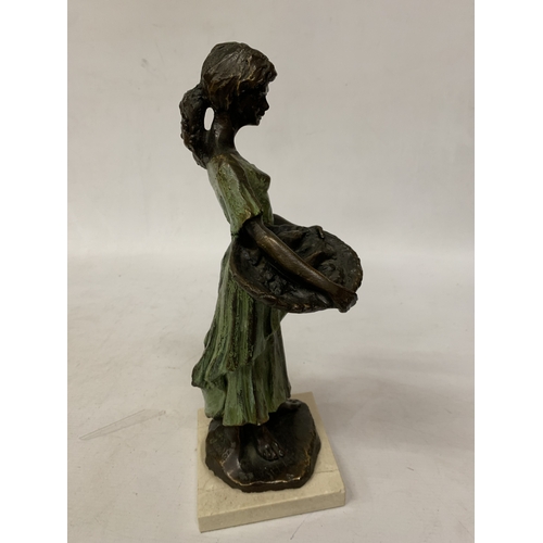 29 - A BRONZE SCULPTURE OF A YOUNG DUTCH GIRL HOLDING A BASKET IN THE STYLE OF WORKS BY SWEDISH ARTIST RU... 