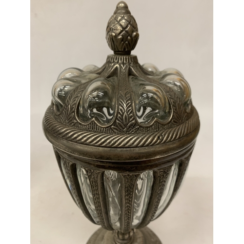 33 - A DECORATIVE LIDDED URN WITH BUBBLE GLASS, PINEAPPLE SHAPED FINIAL ENCASED IN PEWTER - APPROX 32.5 C... 