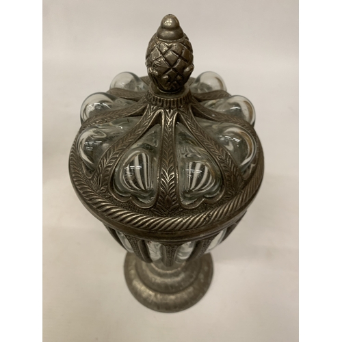 33 - A DECORATIVE LIDDED URN WITH BUBBLE GLASS, PINEAPPLE SHAPED FINIAL ENCASED IN PEWTER - APPROX 32.5 C... 