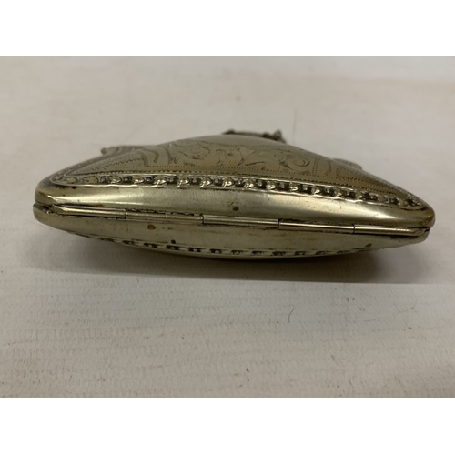 35 - A LATE VICTORIAN SILVER-TONED COIN PURSE WITH INTRICATE ENGRAVING AND FINGER CHAIN