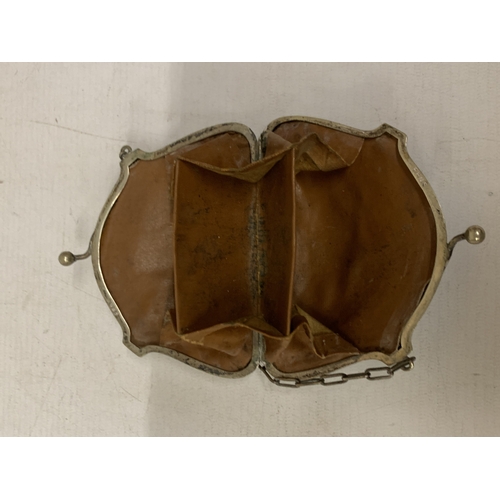 35 - A LATE VICTORIAN SILVER-TONED COIN PURSE WITH INTRICATE ENGRAVING AND FINGER CHAIN