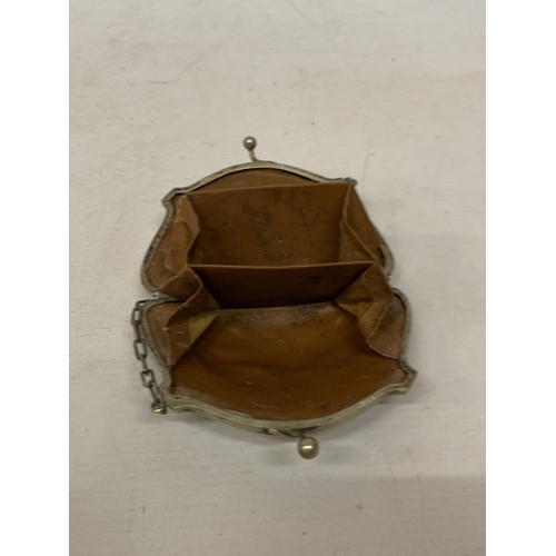 35 - A LATE VICTORIAN SILVER-TONED COIN PURSE WITH INTRICATE ENGRAVING AND FINGER CHAIN