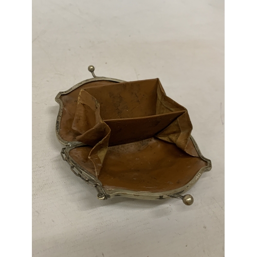 35 - A LATE VICTORIAN SILVER-TONED COIN PURSE WITH INTRICATE ENGRAVING AND FINGER CHAIN