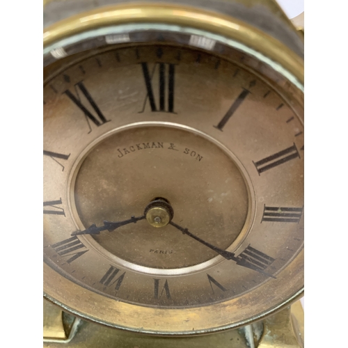 38 - A FRENCH JACKMAN & SON BRASS CARRIAGE CLOCK WITH AN INTEGRATED TOP-MOUNTED COMPASS AND CARRY HANDLE