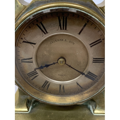 38 - A FRENCH JACKMAN & SON BRASS CARRIAGE CLOCK WITH AN INTEGRATED TOP-MOUNTED COMPASS AND CARRY HANDLE