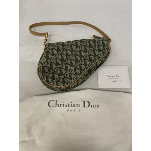 41 - A CHRISTIAN DIOR TROTTER SADDLE CANVAS BAG IN GREEN WITH DUST COVER AND PAPERWORK