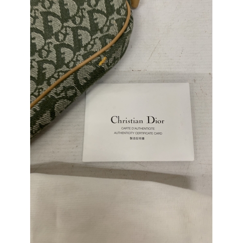 41 - A CHRISTIAN DIOR TROTTER SADDLE CANVAS BAG IN GREEN WITH DUST COVER AND PAPERWORK