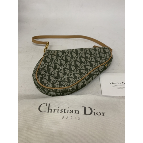 41 - A CHRISTIAN DIOR TROTTER SADDLE CANVAS BAG IN GREEN WITH DUST COVER AND PAPERWORK