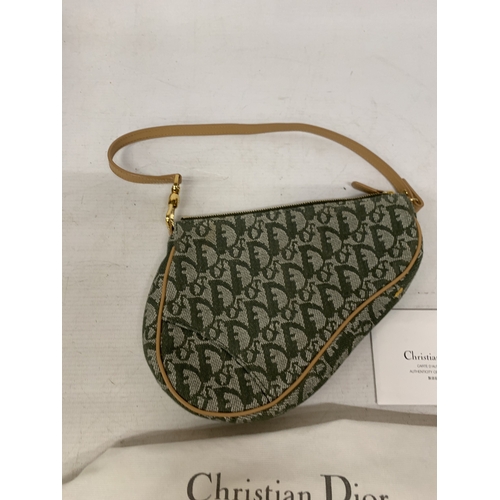 41 - A CHRISTIAN DIOR TROTTER SADDLE CANVAS BAG IN GREEN WITH DUST COVER AND PAPERWORK