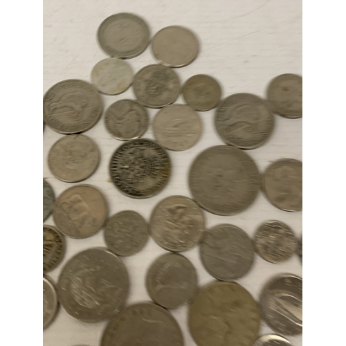53 - A BAG OF WORLD COINS, USA QUARTER DOLLARS, NEW ZEALAND ONE FLORINS, ETC.,