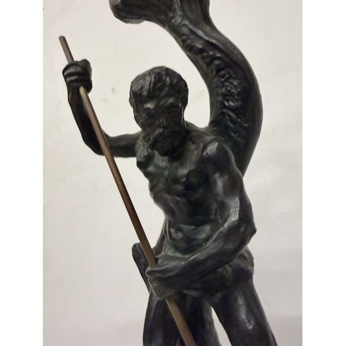 16 - A PATINATED BRONZE SCULPTURE OF NEPTUNE HOLDING A TRIDENT WHILST STANDING ON A STYLIZED SEA CREATURE... 