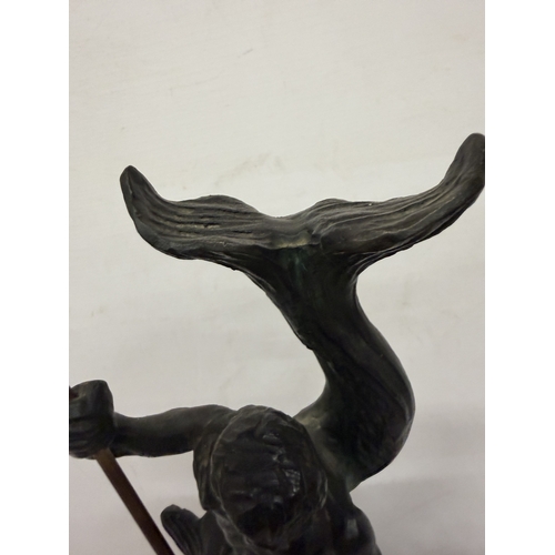 16 - A PATINATED BRONZE SCULPTURE OF NEPTUNE HOLDING A TRIDENT WHILST STANDING ON A STYLIZED SEA CREATURE... 