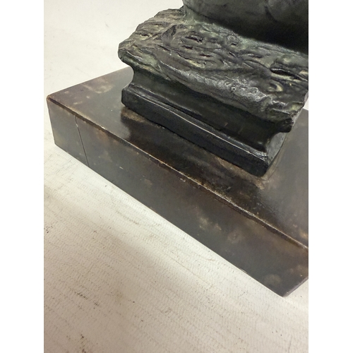16 - A PATINATED BRONZE SCULPTURE OF NEPTUNE HOLDING A TRIDENT WHILST STANDING ON A STYLIZED SEA CREATURE... 