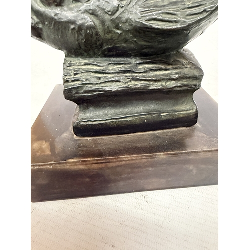 16 - A PATINATED BRONZE SCULPTURE OF NEPTUNE HOLDING A TRIDENT WHILST STANDING ON A STYLIZED SEA CREATURE... 