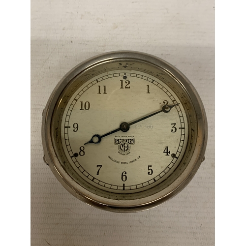 13 - A VINTAGE 1930'S SMITH'S CAR DASHBOARD CLOCK, WITH A WHITE DIAL AND BLUE HANDS, MADE BY THE CRICKLEW... 