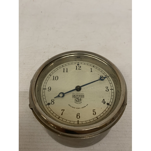 13 - A VINTAGE 1930'S SMITH'S CAR DASHBOARD CLOCK, WITH A WHITE DIAL AND BLUE HANDS, MADE BY THE CRICKLEW... 