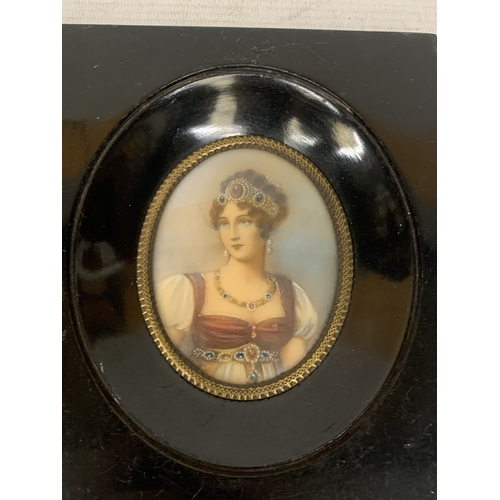14 - TWO MINIATURE HAND PAINTED CEARAMIC PORTRAITS IN WOODEN FRAMES