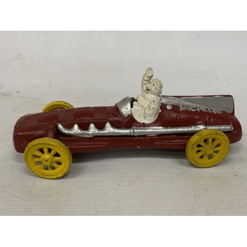 17 - A CAST MODEL OF A MICHELIN MAN AND CAR, LENGTH 16CM