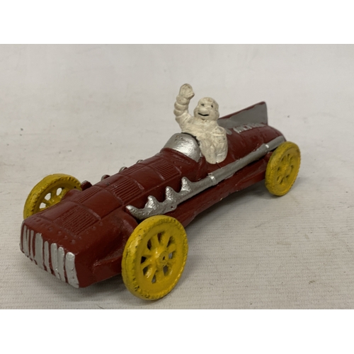 17 - A CAST MODEL OF A MICHELIN MAN AND CAR, LENGTH 16CM