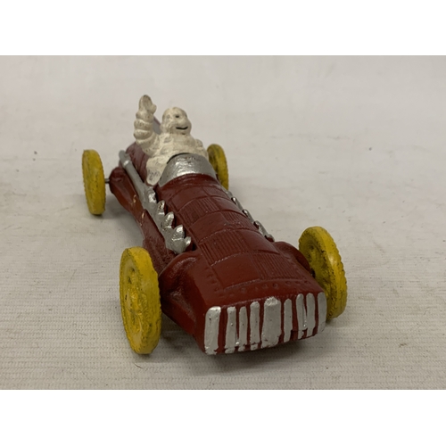 17 - A CAST MODEL OF A MICHELIN MAN AND CAR, LENGTH 16CM
