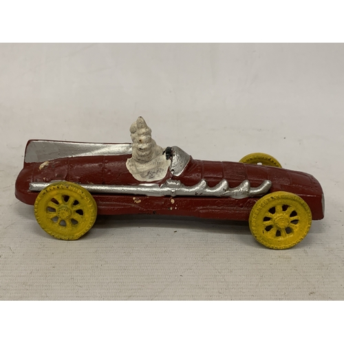17 - A CAST MODEL OF A MICHELIN MAN AND CAR, LENGTH 16CM
