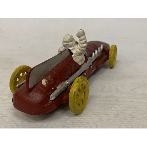 17 - A CAST MODEL OF A MICHELIN MAN AND CAR, LENGTH 16CM
