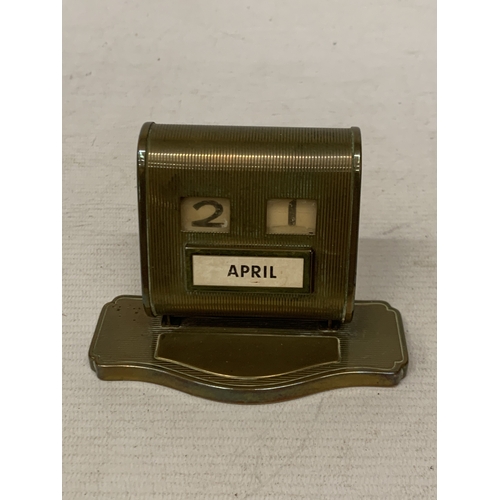 21 - A 1930'S BRASS PERPETUAL DESK CALENDAR