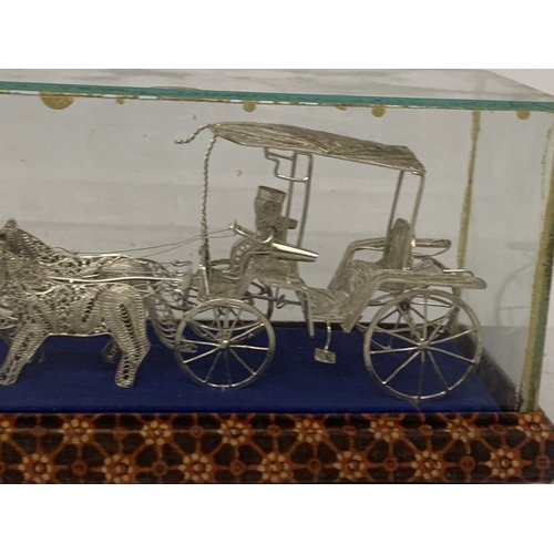 7 - A SILVER WIRE MODEL OF A CARRIAGE AND HORSES IN A GLASS CASE
