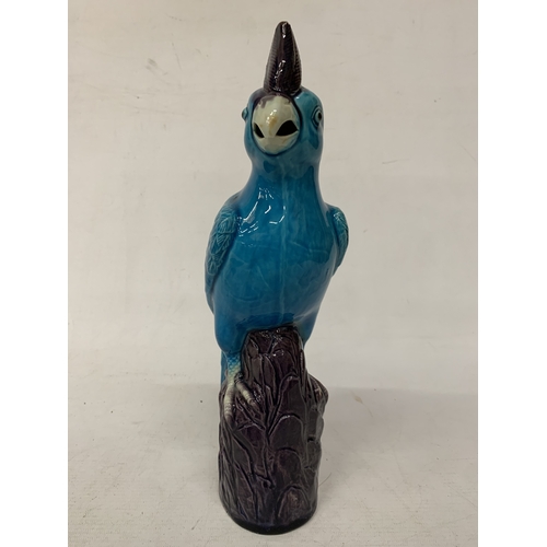 42 - A VINTAGE CHINESE PORCELAIN PARROT FIGURE, WITH A TURQUOISE GLAZED BODY AND AUBERGINE COLOURED CREST... 
