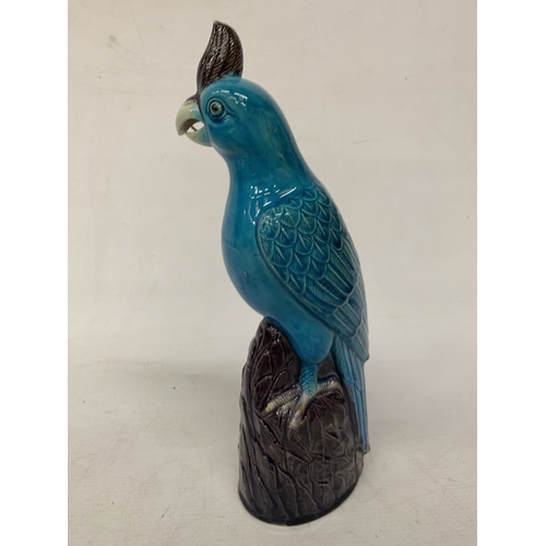 42 - A VINTAGE CHINESE PORCELAIN PARROT FIGURE, WITH A TURQUOISE GLAZED BODY AND AUBERGINE COLOURED CREST... 