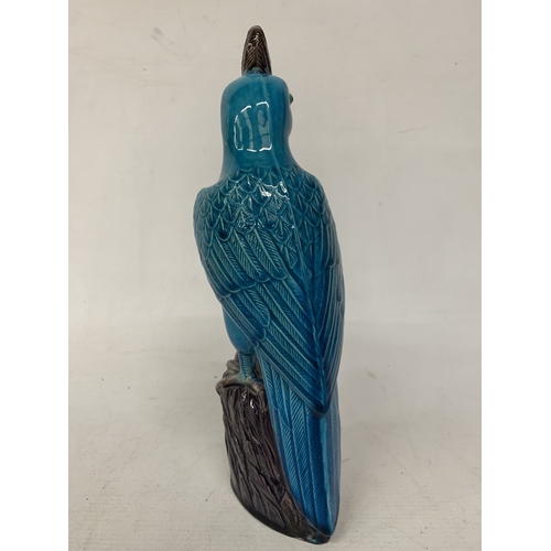 42 - A VINTAGE CHINESE PORCELAIN PARROT FIGURE, WITH A TURQUOISE GLAZED BODY AND AUBERGINE COLOURED CREST... 