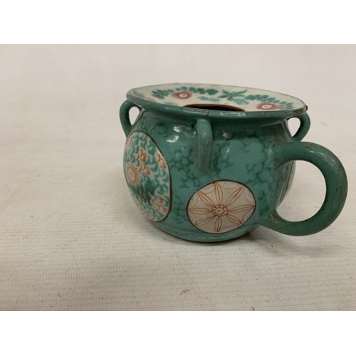 44 - A CHINESE ENAMELLED YIXING TEAPOT WITH A GREEN GLAZED BODY AND ENAMELLED FLORAL DECORATION